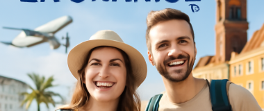 Prosty, nowoczesny portret kobiety o jasnej karnacji, z długimi, falującymi blond włosami, na tle miejskiego krajobrazu w słoneczny dzień.